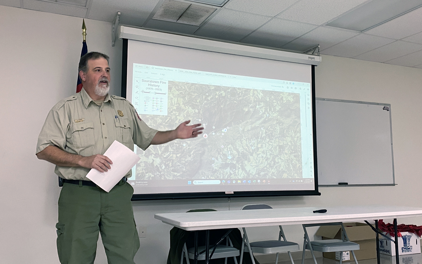 Jonathan Young, Stokes County ranger for the N.C. Forest Service, discusses the history of fire on Sauratown Mountain with residents.