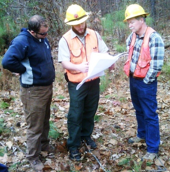 Forest Service Staff discussing results of Inspection with loggers and timber buyers